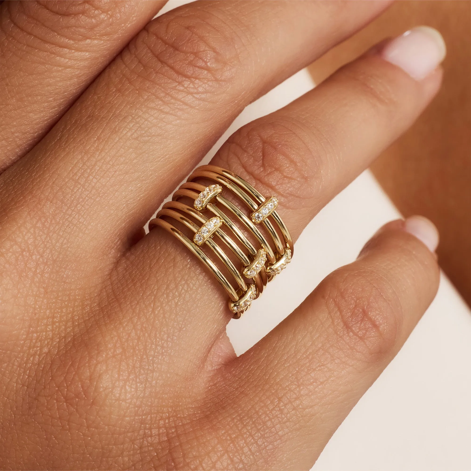 Cour d'Honneur Adora 14 karat golden 7-piece multiring with zirconia stones