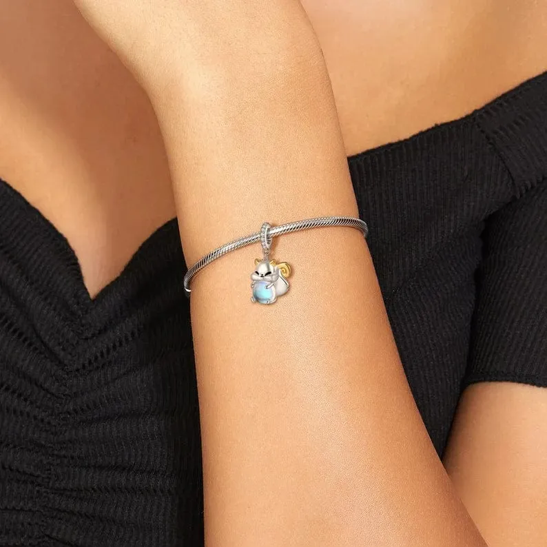 Squirrel Hugging a Light Sphere Dangle Charm
